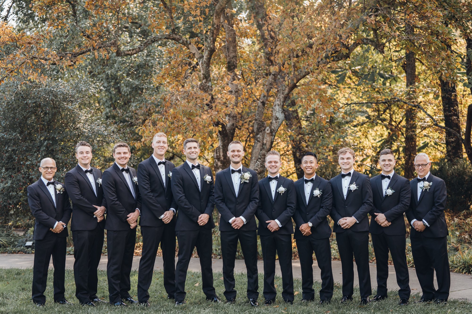 Full wedding party portrait in autumn
