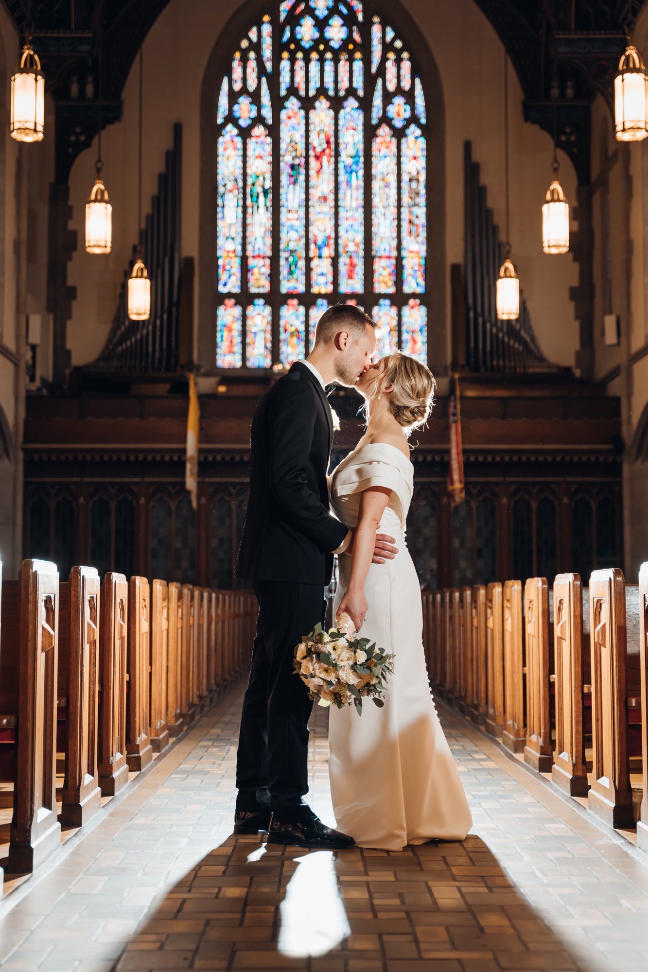 Newlyweds portrait inside a historic chapel